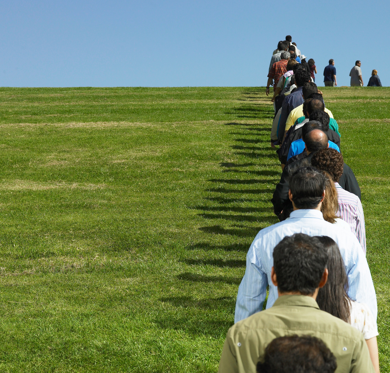 People standing in line in field