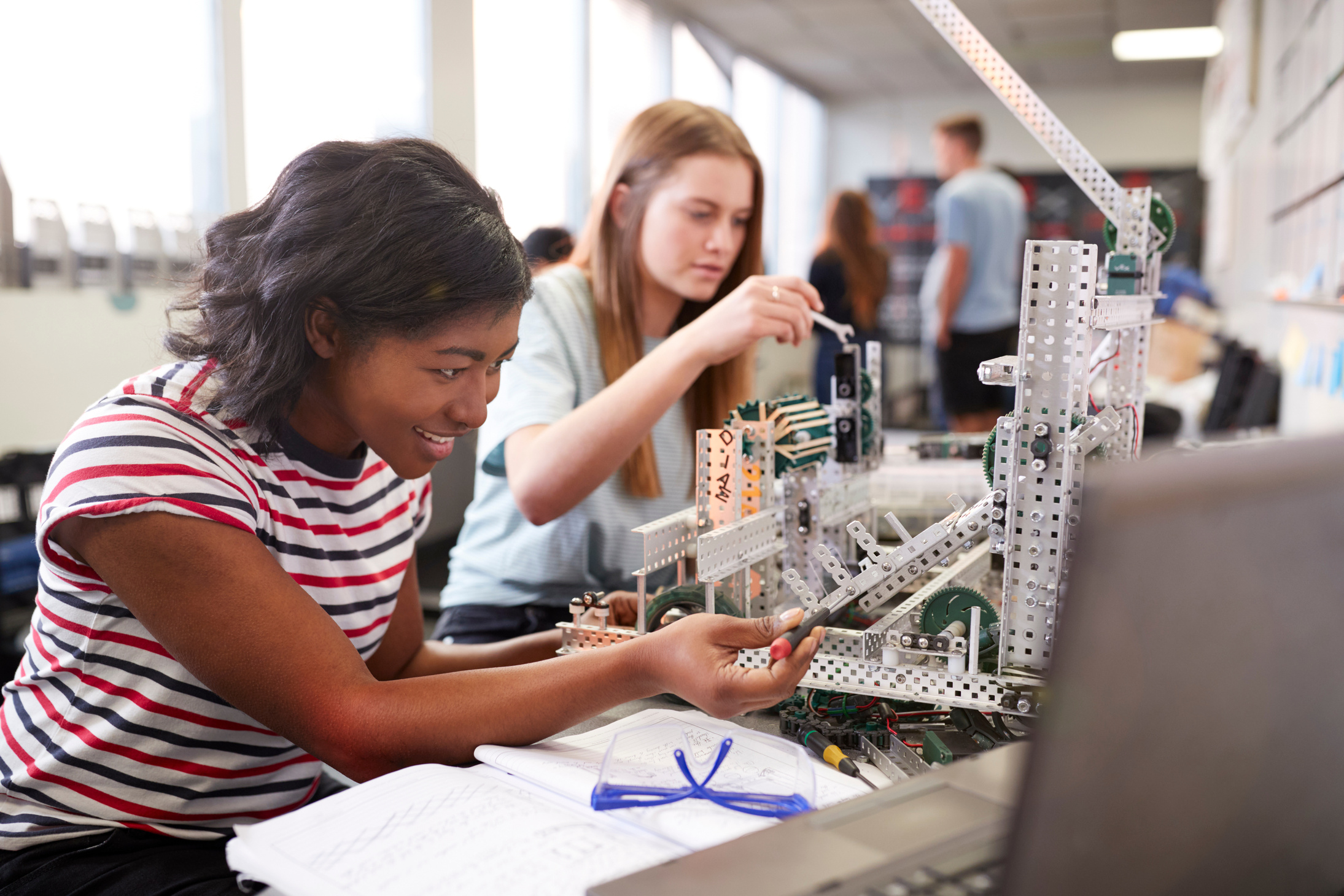 Two Female College Students Building Machine in Science Robotics